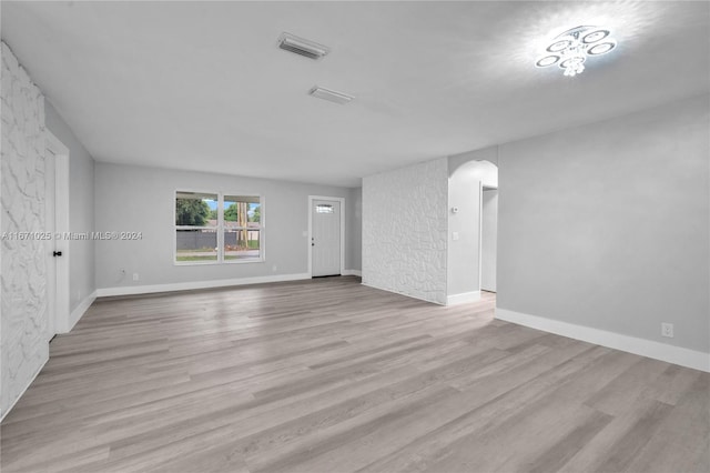 unfurnished room with light hardwood / wood-style floors