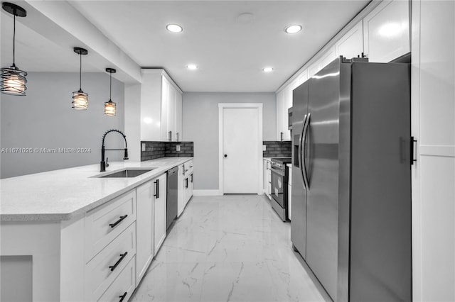 kitchen with stainless steel appliances, white cabinets, hanging light fixtures, and sink