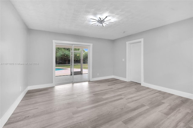 spare room featuring light hardwood / wood-style flooring