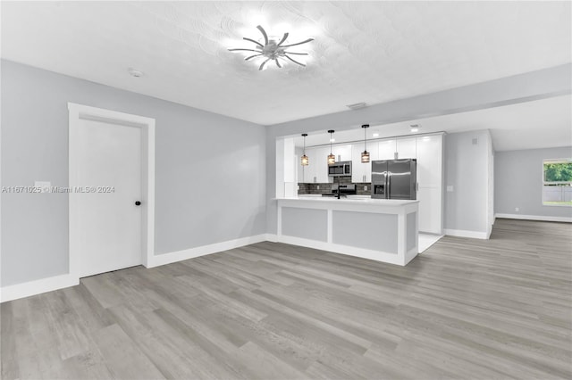 unfurnished living room with light wood-type flooring