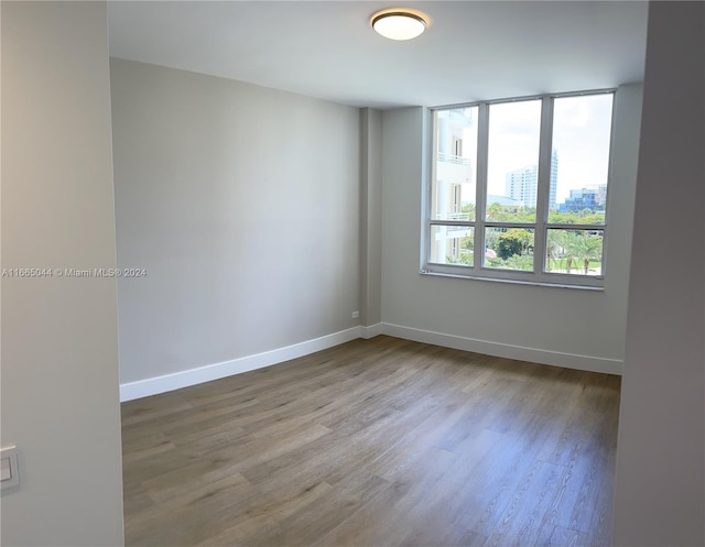 spare room featuring hardwood / wood-style flooring