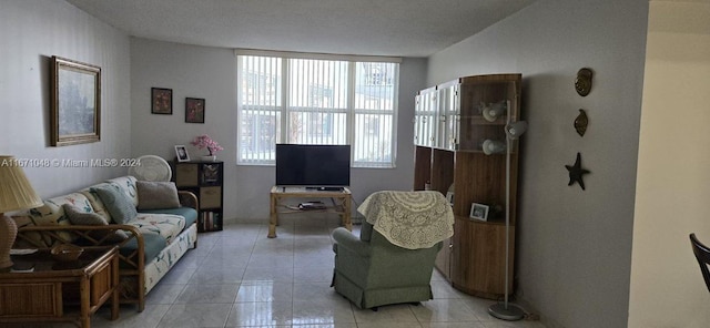 tiled living room with a textured ceiling