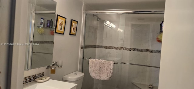 bathroom with walk in shower and toilet