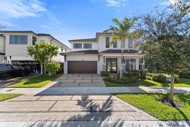 view of front of home featuring a garage and french doors