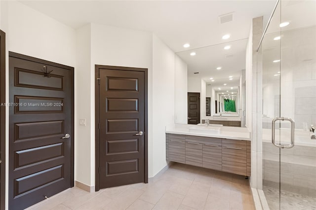 bathroom with vanity, tile patterned floors, and an enclosed shower