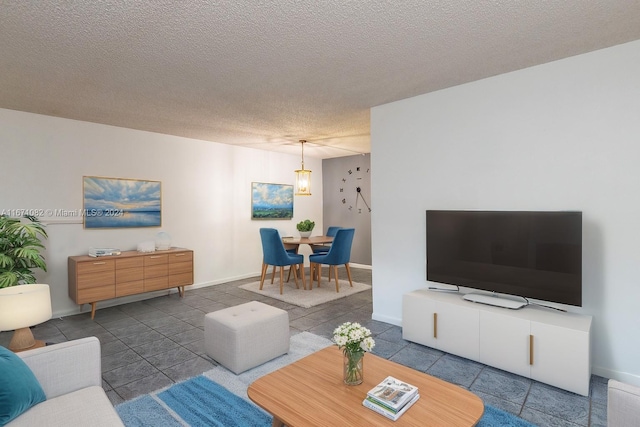 tiled living room featuring a textured ceiling