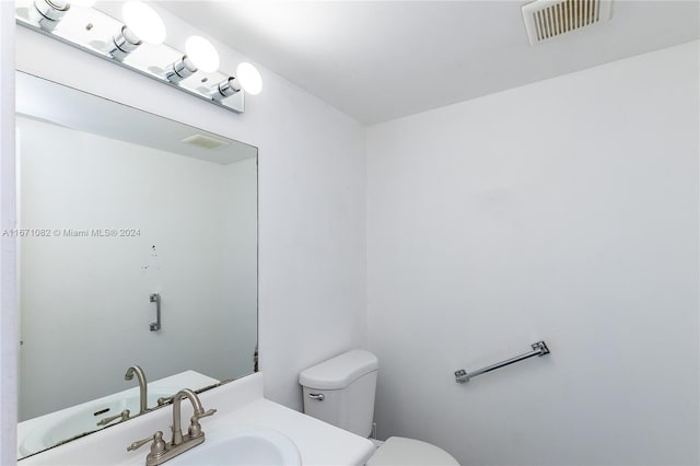 bathroom featuring sink and toilet