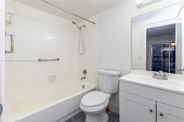 full bathroom with tile patterned flooring, tiled shower / bath combo, vanity, and toilet