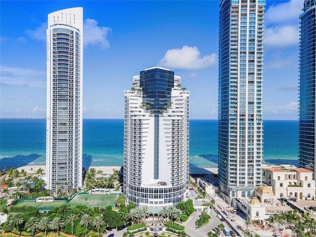 property's view of city with a view of the beach and a water view