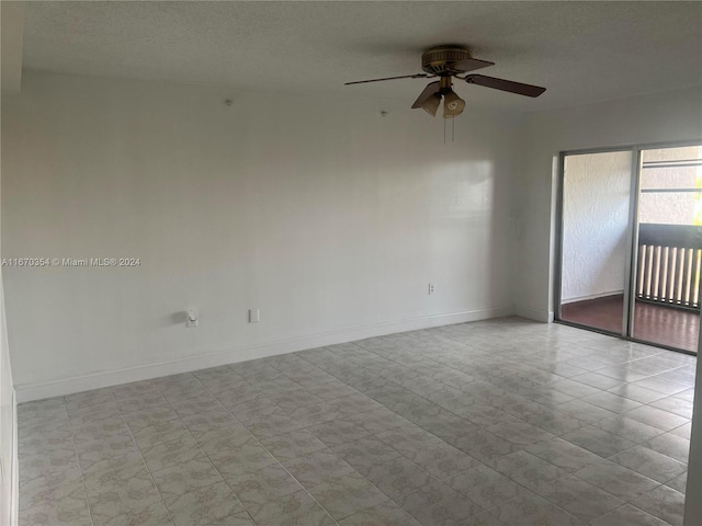 unfurnished room featuring a textured ceiling and ceiling fan