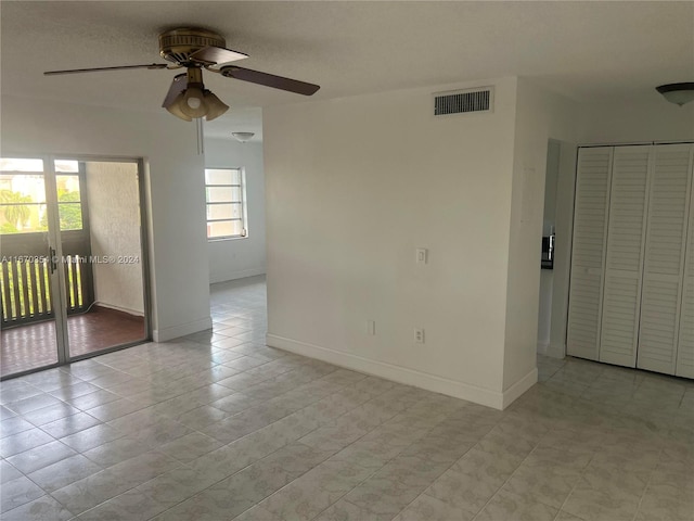 empty room featuring ceiling fan