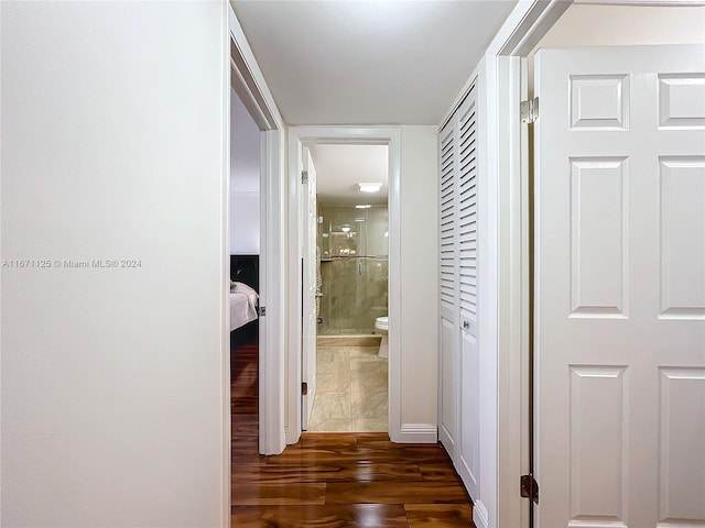 corridor with dark hardwood / wood-style floors