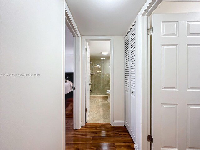 hallway featuring dark wood-type flooring