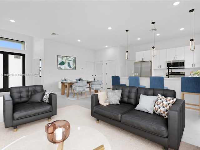 living room featuring light colored carpet