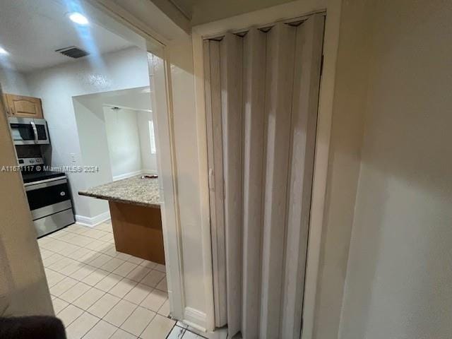 bathroom with tile patterned flooring