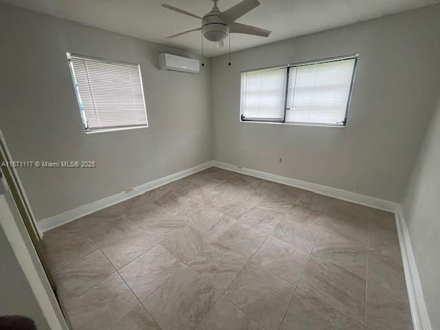 bathroom with tile walls, vanity, and toilet