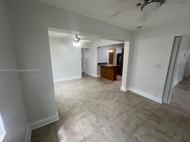 unfurnished room featuring ceiling fan