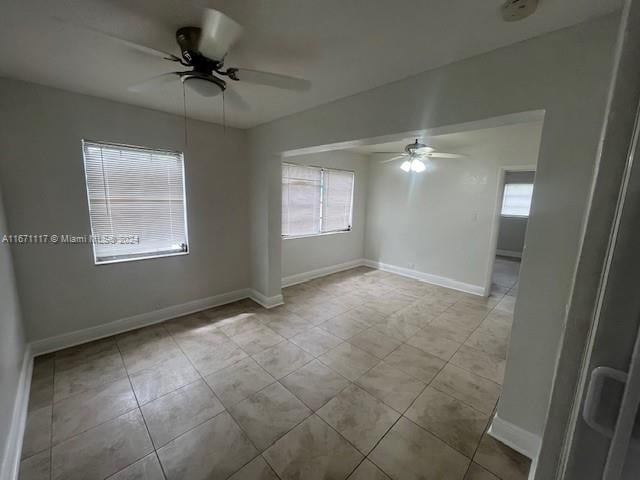 spare room with ceiling fan