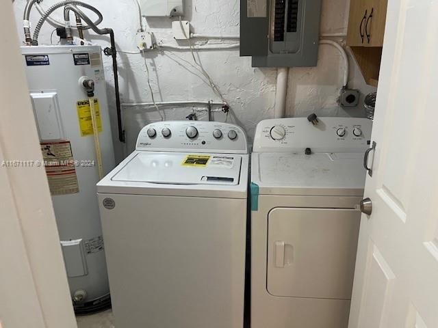 washroom featuring separate washer and dryer, water heater, and electric panel