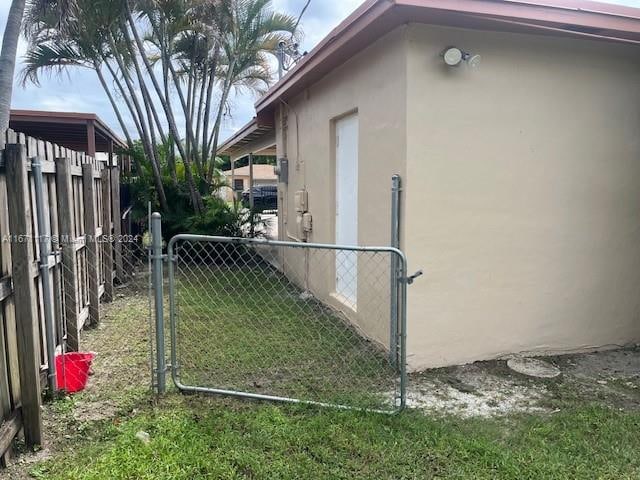 view of side of property with a lawn