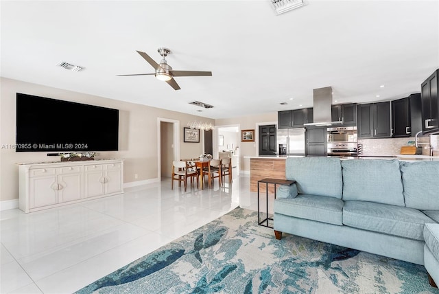 tiled living room featuring ceiling fan