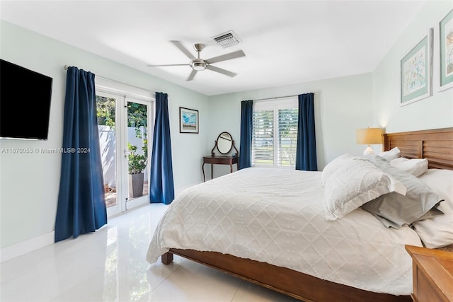 bedroom featuring access to outside, multiple windows, ceiling fan, and light tile patterned floors