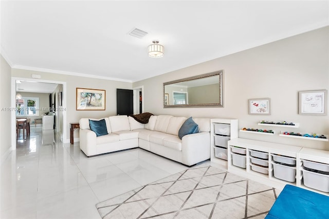 tiled living room with ornamental molding