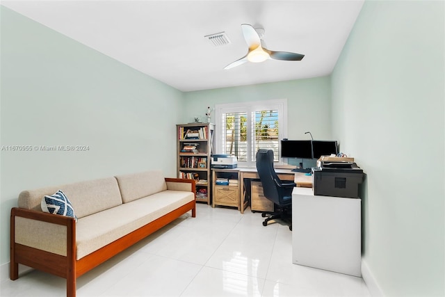 home office with tile patterned floors and ceiling fan