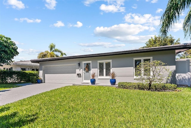 single story home with a front lawn and a garage