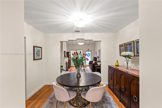 dining area with light hardwood / wood-style floors