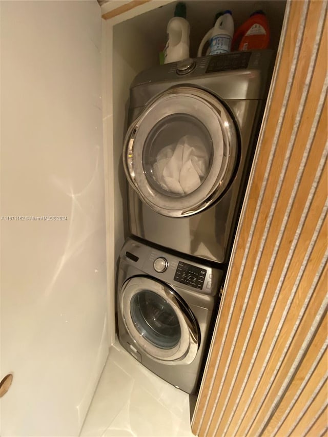 1850 S Ocean Dr Unit 3109, Hallandale Beach, FL 33009 - laundry area featuring tile patterned flooring, stacked washing maching and dryer, and laundry area