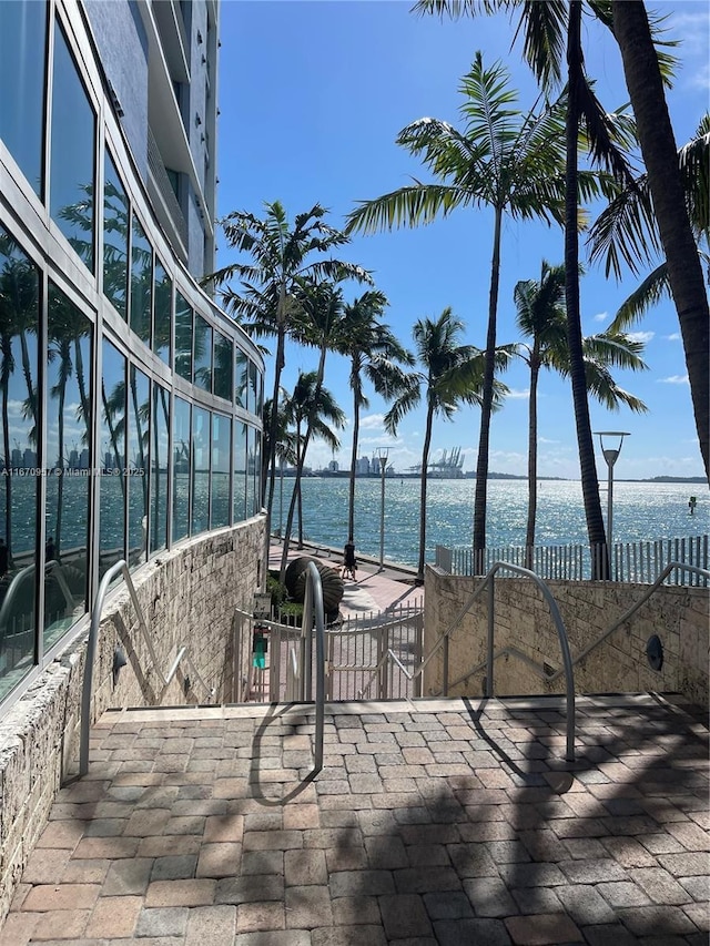 view of pool featuring a water view