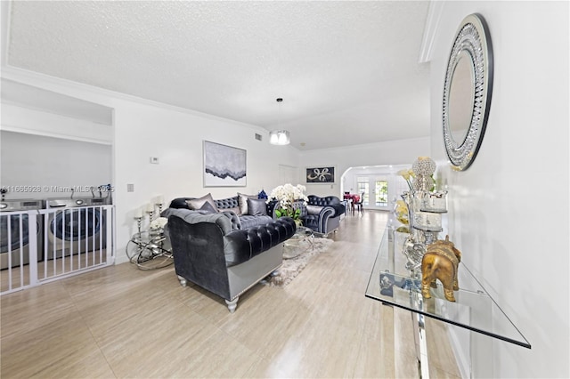 living room with a textured ceiling and washer / dryer