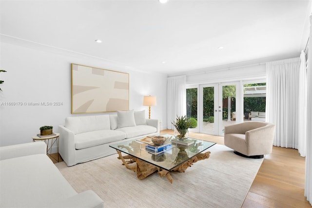 living room featuring french doors and light wood-type flooring