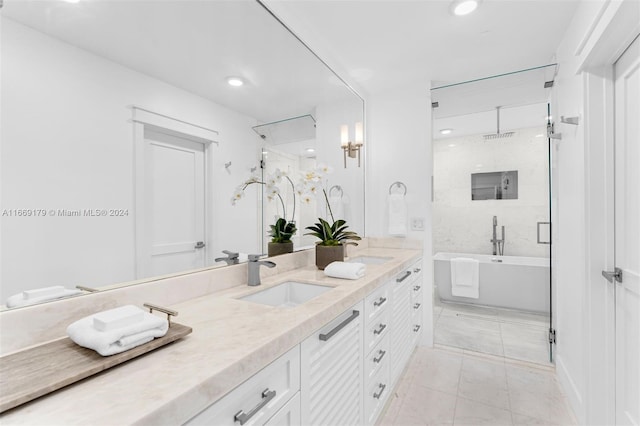 bathroom featuring tile patterned flooring, independent shower and bath, and vanity