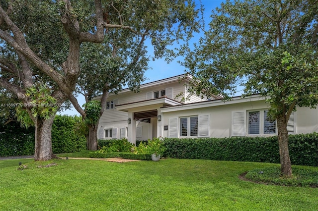 front facade with a front lawn