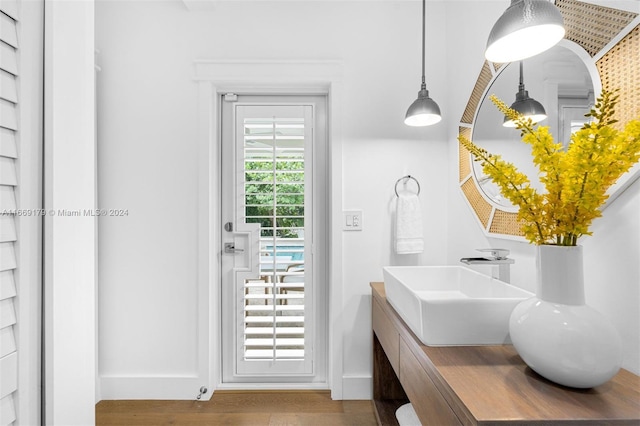 bathroom with hardwood / wood-style flooring and vanity