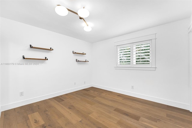 spare room with hardwood / wood-style flooring