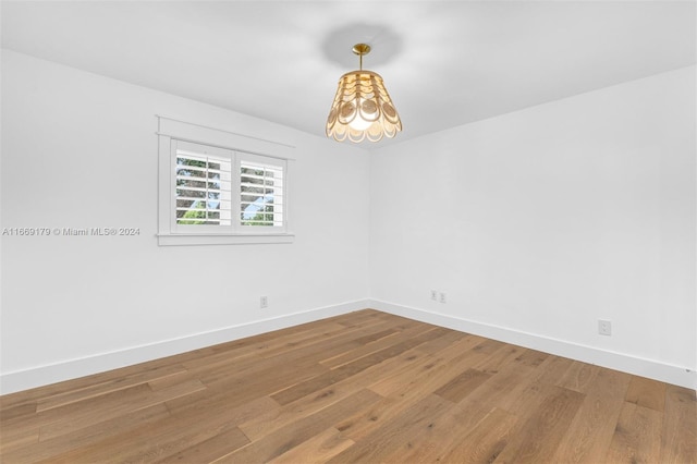 spare room featuring hardwood / wood-style flooring