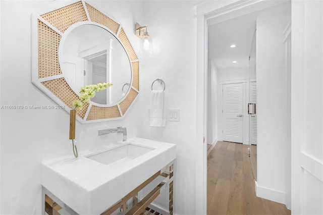 bathroom featuring vanity and hardwood / wood-style floors