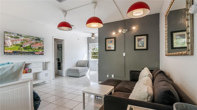 living room with ceiling fan and light tile patterned floors