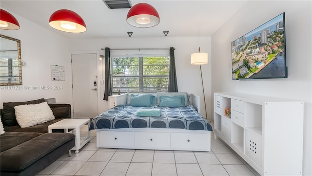 bedroom with light tile patterned floors