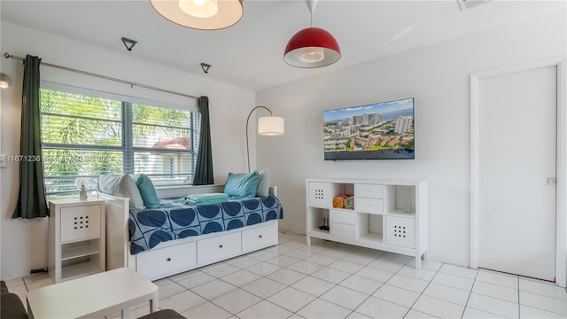 bedroom featuring light tile patterned floors