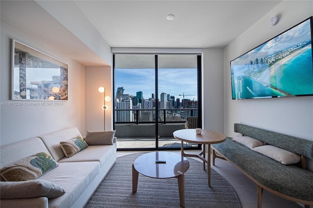 living room featuring floor to ceiling windows