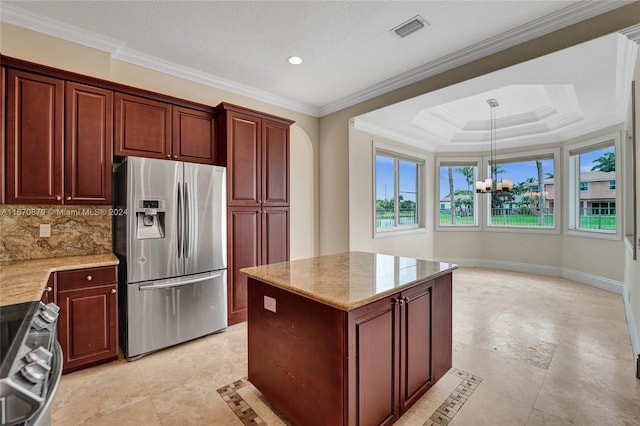 kitchen featuring a notable chandelier, hanging light fixtures, ornamental molding, light stone countertops, and appliances with stainless steel finishes