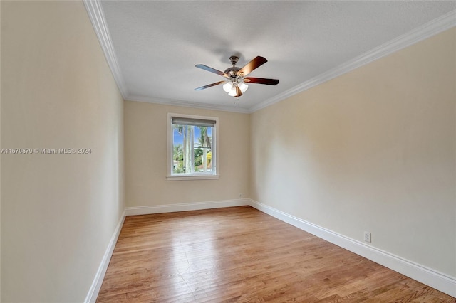 empty room featuring a textured ceiling, light hardwood / wood-style flooring, ceiling fan, and crown molding