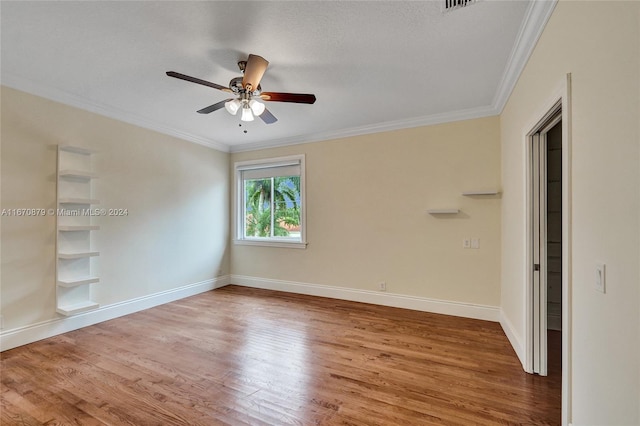 unfurnished room with ceiling fan, wood-type flooring, a textured ceiling, and ornamental molding