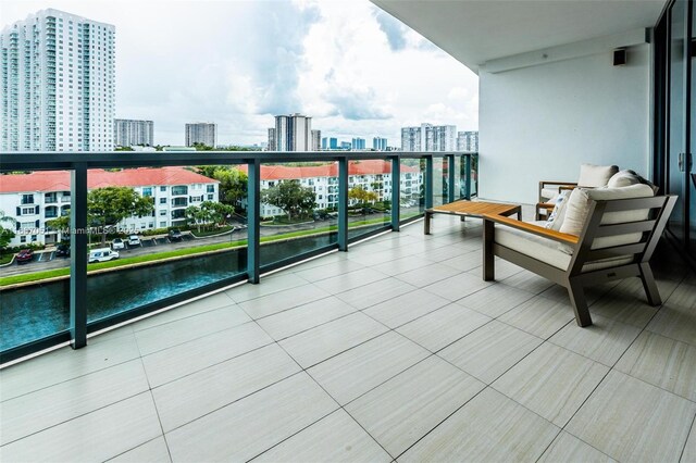 balcony featuring a water view