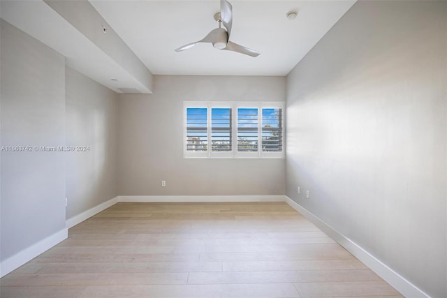 unfurnished room with light wood-type flooring and ceiling fan