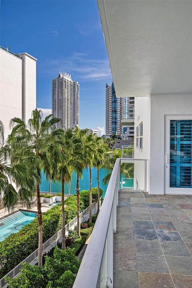 balcony featuring a water view